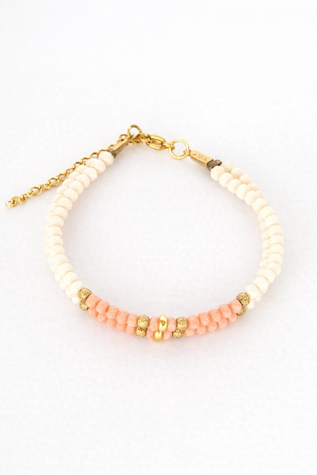 Pulsera de cristal doble blanco y rosa.