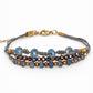 Pulsera azul y bronce.
