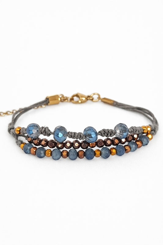 Pulsera azul y bronce.