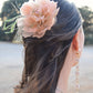 Headdress with dahlia and feathers.