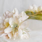 Headdress of azaleas and hydrangeas.