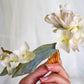 Headdress of azaleas and hydrangeas.