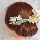 Headdress of azaleas and hydrangeas.