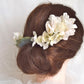 Headdress of azaleas and hydrangeas.