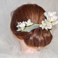 Headdress of azaleas and hydrangeas.